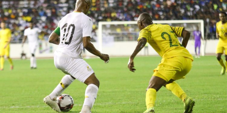 Thembinkosi Lorch of South Africa challenging Andre Ayew of Ghana during the 2021 Africa Cup of Nations qualifiers match between Ghana and South Africa at Cape Coast Sports Stadium,Ghana on 14 November 2019 ©BackpagePix