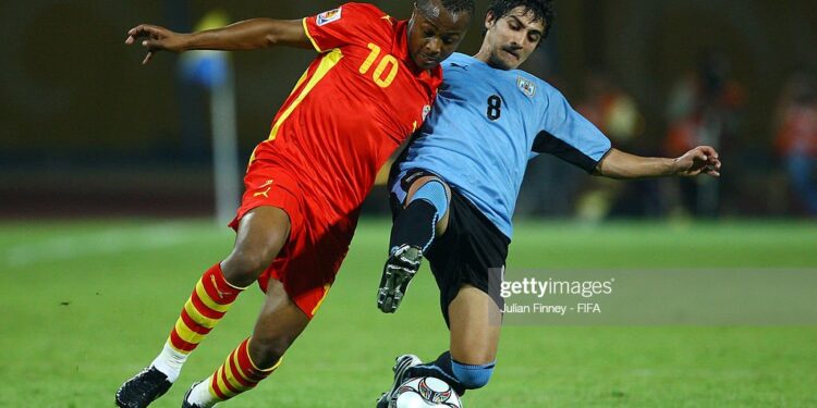 ISMAILIA, EGYPT - OCTOBER 02:  Andre Ayew of Ghana battles with Maximiliano Calzada of Uruguay during the Group D, FIFA U20 World Cup match between Uruguay and Ghana at the Ismailia Stadium on October 2, 2009 in Ismailia, Egypt.  (Photo by Julian Finney - FIFA/FIFA via Getty Images)