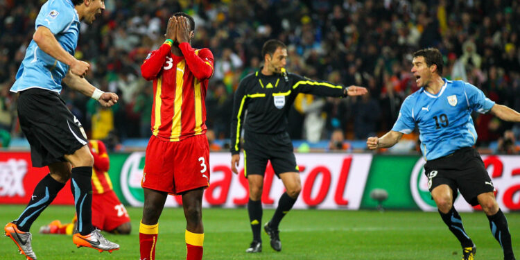 JOHANNESBURG, SOUTH AFRICA - JULY 02: Asamoah Gyan of Ghana reacts as he misses a late penalty kick in extra time to win the match during the 2010 FIFA World Cup South Africa Quarter Final match between Uruguay and Ghana at the Soccer City stadium on July 2, 2010 in Johannesburg, South Africa. (Photo by Cameron Spencer/Getty Images)