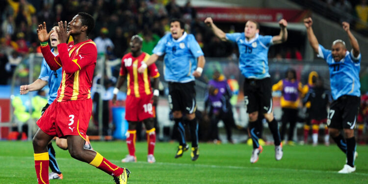 JOHANNESBURG, SOUTH AFRICA - JULY 02: Asamoah Gyan of Ghana reacts as he misses a late penalty kick in extra time to win the match during the 2010 FIFA World Cup South Africa Quarter Final match between Uruguay and Ghana at the Soccer City stadium on July 2, 2010 in Johannesburg, South Africa. (Photo by Clive Mason/Getty Images)
