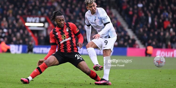 BOURNEMOUTH, ENGLAND - MARCH 11: ( THE SUN OUT,THE SUN ON SUNDAY OUT)  Roberto Firmino of Liverpool with Antoine Semenyo of AFC Bournemouth  during the Premier League match between AFC Bournemouth and Liverpool FC at Vitality Stadium on March 11, 2023 in Bournemouth, England. (Photo by Andrew Powell/Liverpool FC via Getty Images)