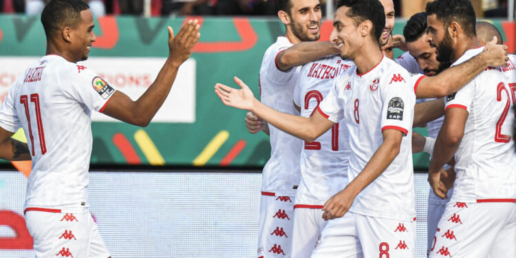 Tunisia's players celebrate after scoring a goal during the Group F Africa Cup of Nations (CAN) 2021 football match between Tunisia and Mauritania at Limbe Omnisport Stadium in Limbe on January 16, 2022. (Photo by Issouf SANOGO / AFP)