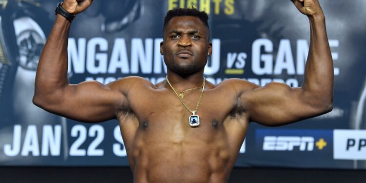 ANAHEIM, CALIFORNIA - JANUARY 21: Francis Ngannou of Cameroon poses on the scale during the UFC 270 ceremonial weigh-in at the Anaheim Convention Center on January 21, 2022 in Anaheim, California. (Photo by Chris Unger/Zuffa LLC)