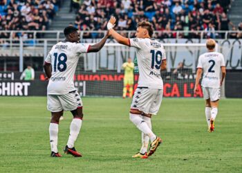 Ghanaian forward Caleb Ekuban scores for Genoa against AC Milan