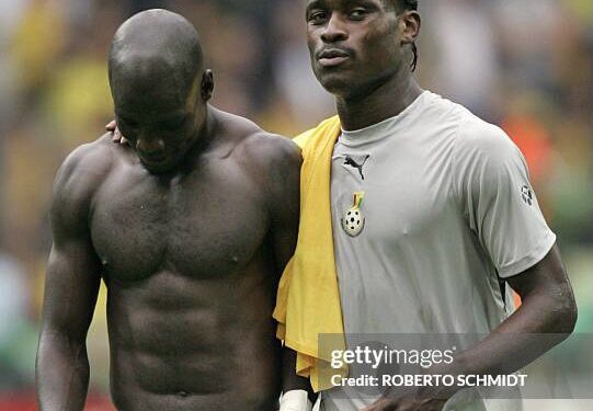 Dortmund, GERMANY: Ghanaian midfielder Stephen Appiah (L) and Ghanaian midfielder Derek Boateng (R) leave the pitch after their defeat in the round of 16 World Cup football match between Brazil and Ghana at Dortmund's World Cup Stadium, 27 June 2006. Brazil won the match 3-0 and will play either France or Spain in the next round. AFP PHOTO / ROBERTO SCHMIDT (Photo credit should read ROBERTO SCHMIDT/AFP via Getty Images)