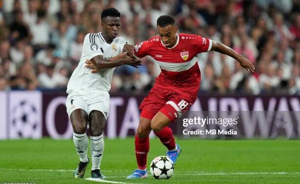 MADRID, SPAIN - SEPTEMBER 17: Jamie Leweling of VfB Stuttgart compete for the ball with Vinicius Junior of Real Madrid during the UEFA Champions League 2024/25 League Phase MD1 match between Real Madrid CF and VfB Stuttgart at Estadio Santiago Bernabeu on September 17, 2024 in Madrid, Spain. (Photo by MB Media/Getty Images)