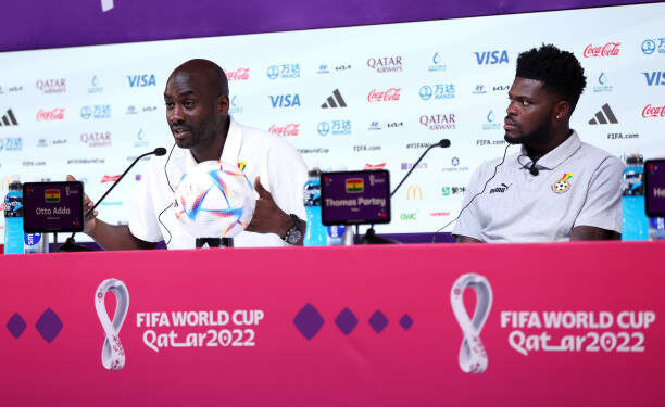 DOHA, QATAR - DECEMBER 01: Otto Addo, Head Coach of Ghana, and Thomas Partey of Ghana speak during the Ghana Press Conference at the Main Media Center on December 01, 2022 in Doha, Qatar. (Photo by Christopher Lee/Getty Images)