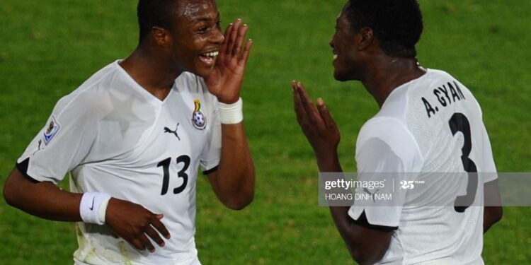Ghana's striker Asamoah Gyan (R) celebrates with midfielder Andre Ayew after scoring a penalty kick  the Group D first round 2010 World Cup football match Serbia vs Ghana on June 13, 2010 at Loftus Verfeld stadium in Tshwane/Pretoria. Ghana defeated Serbia 1-0. NO PUSH TO MOBILE / MOBILE USE SOLELY WITHIN EDITORIAL ARTICLE -       AFP PHOTO / HOANG DINH NAM (Photo credit should read HOANG DINH NAM/AFP via Getty Images)