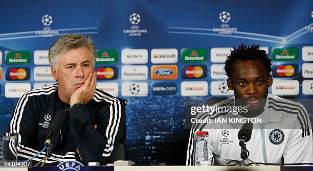 Chelsea's Italian manager Carlo Ancelotti (L) and Ghanaian footballer Michael Essien answer questions during a press conference on the eve of their Champions League Group D match against Apoel Nicosia at Chelsea's training facility in Cobham, southern England, on December 7, 2009. AFP PHOTO/Ian Kington (Photo credit should read IAN KINGTON/AFP via Getty Images)